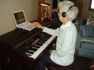 Jean working on recording music at our piano.