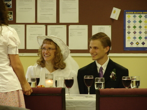 Daniel and Kristina sitting at the wedding family table.