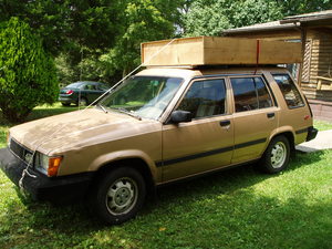 Bringing home a big bookcase so we could unpack the rest of our books. We don't have a pickup, so this car is our "truck!"