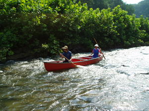 Coming back, Daniel and his Mom decided to ride the canoe downstream through the rapids. They had a blast!