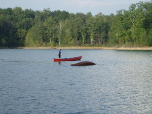 Daniel coming to rescue the nearly submerged canoe.