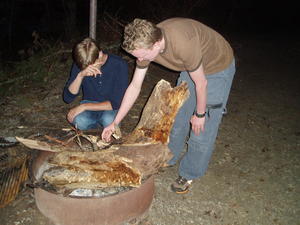 Lighting a campfire--everything was wet from the rain, and Daniel got tired after blowing on it for 20 minutes!