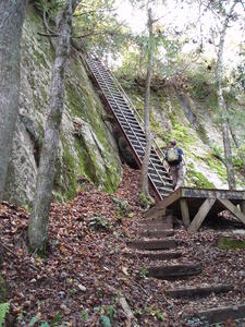 Erick going up tallest ladder we had to climb (we had to come back DOWN it too!)