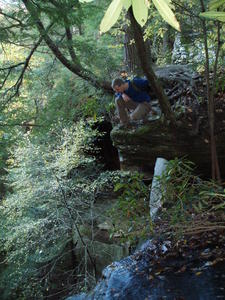 Erick sitting as close to the edge of Yahoo Falls as possible.