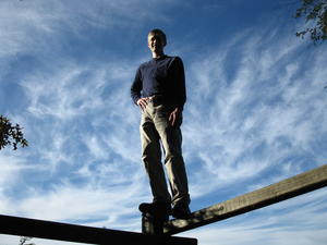 Daniel standing on the fence.