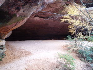 Standing in the mouth of sand cave (more like a rock shelter). The sand inside was like powder that went poof! poof! with every step!