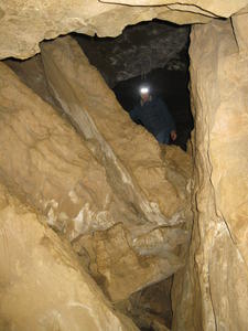 Daniel standing in a passageway.