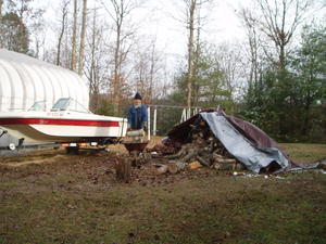 Daniel and I have been hauling and stacking the wood we got a few weeks ago. We finallly finished it! Here's Daniel hauling after we'd done half the pile.