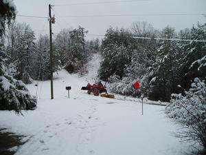 We are blessed with next door neighbors who used to live in Michigan--and who brought their tractor and snowplow with them when they moved! He was SO excited for a chance to use it!