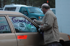 Leon doing the finishing touches with window wax.