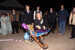 Note the trail of tin cans behind the wheelbarrow!