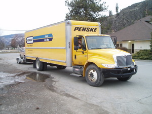 Our 26 ft. Penske pulling Kristina's car.