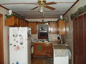 Here is our sweet little kitchen! The closet doors on the right are hiding the washing machine and dryer, making it convenient for doing laundry! (even if it is a bit noisy)