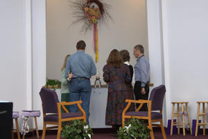 Parents practicing lighting the candles.