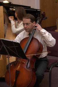 Harvey playing during one of the songs.