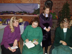 Opening gifts, with Kim and Kristina's mother being the scribes. 