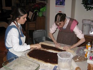 Rolling up the dough with date/apple filling.