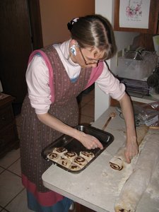 Slicing the sweet rolls with string for a clean cut.