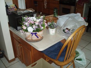 The tiny watering can for the flower girl, candle holders, and the basket with all the leftover flowers after we were done with everything else.