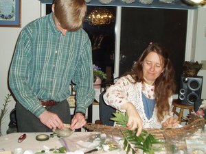 Christy doing flower arrangements on our floral wreaths.