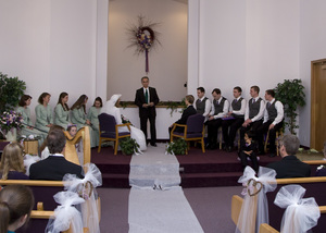 The wedding party is seated.