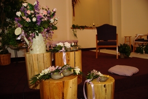 Lamps and flower bouquets where Bridesmaids laid them when they walked up.