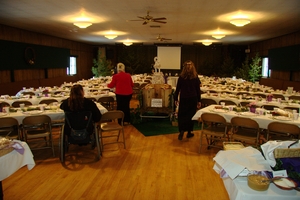 Inside the Grange, the food crew were hard at work putting out the food and getting the cake set up.