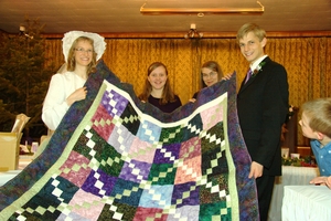 A beautiful quilt handmade by Kristina's "three little sisters" from Northport church, with the help of all the Northport church ladies. It now sits in our living room where we can warm up under it when it's cold. 