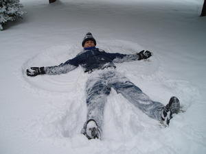 Daniel making a snow angel.