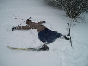 Step three: Turn your feet out and start making angel wings with your arms and ski poles.