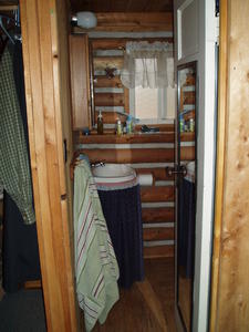 The cute little bathroom and shower--cozy but works well.