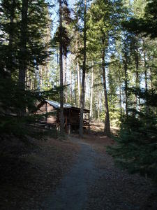 Far away view of the cabin, from down the trail.