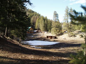 Looking back at their house from the road. (The cabin is hiding up the hill behind the house, in the woods)