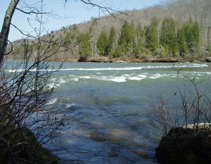 Closer to the rapids.