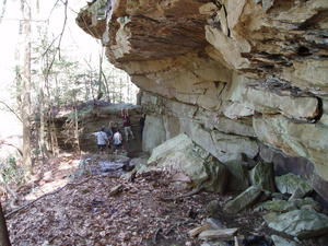 When the trail leads you to a wall, you either climb over it, under it, or squeeze through it! (Our group did all three!)