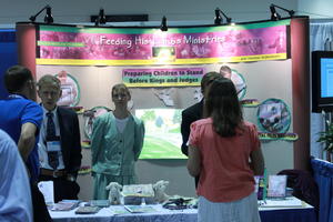 We had permission to advertise Discovering His Treasures ministry, but since we didn't have our own booth, Feeding His Lambs let us use theirs if we helped them.