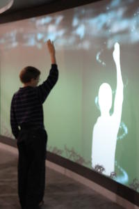 Levi playing with an interactive wall.