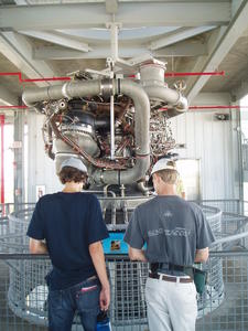 Daniel and Lucas looking at part of the engine--it was nearly two stories tall!