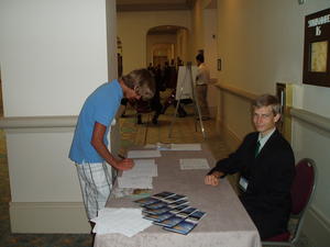 Daniel working the sign-in desk.