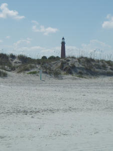 A lighthouse in the background at Ponce Landing.