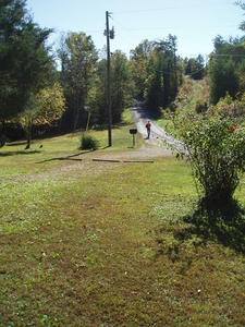 Lucas walking home from the school bus stop.