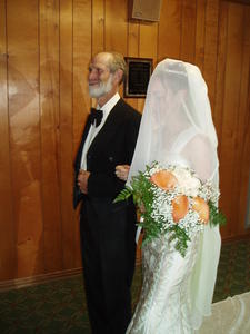 Autumn, the happy bride, with her Dad.