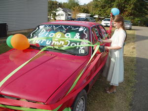 Daniel's job was to make sure the car was well taken care of. :) Here the flower girl helps put on the finishing touches.