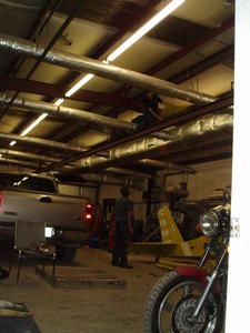 At a friend's shop, Israel talking to Lawrence (the one up high)