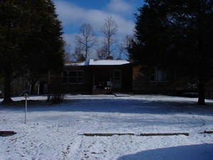 Our house in the first snow of winter.