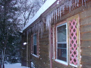 Icicles forming over the kitchen and bedroom windows.