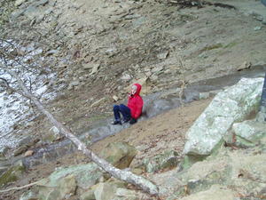 Daniel trying to go down the ice-covered stairs to the bottom of the falls.