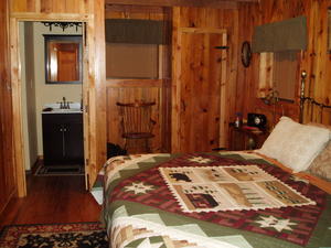 View of master bedroom, closet and bathroom from doorway.