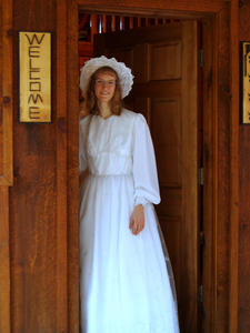 Kristina standing in the front doorway.