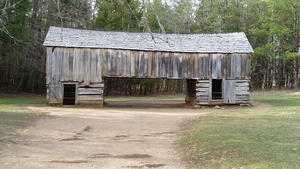 Double-sided barn with overhang in the middle.